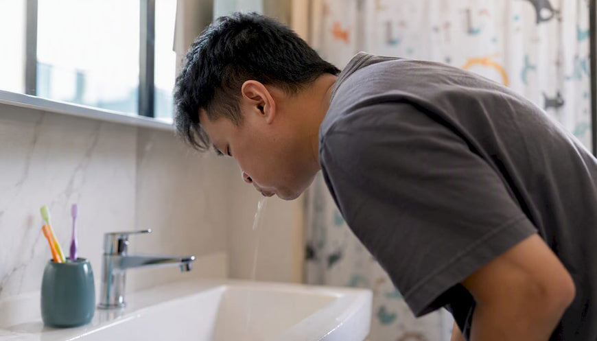 Busy parent applying toothpaste in bathroom