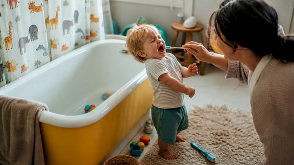 Toddler refusing to brush teeth in bathroom