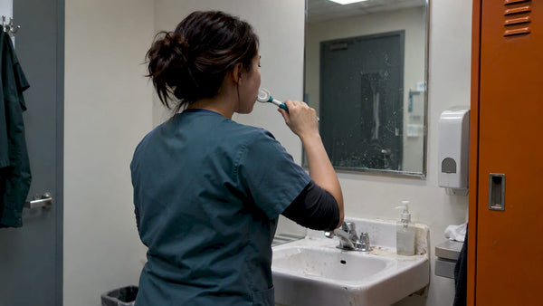 Shift worker brushing teeth between shifts